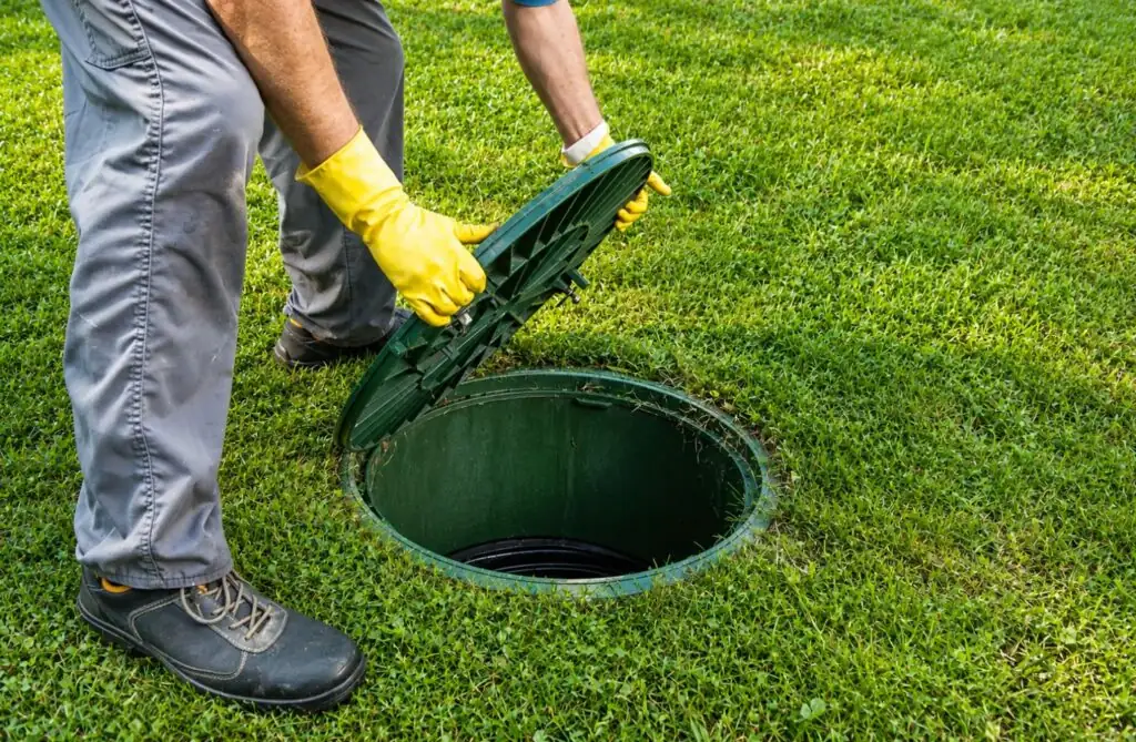 Septic tank inspection in Lufkin, TX with the tank lid open